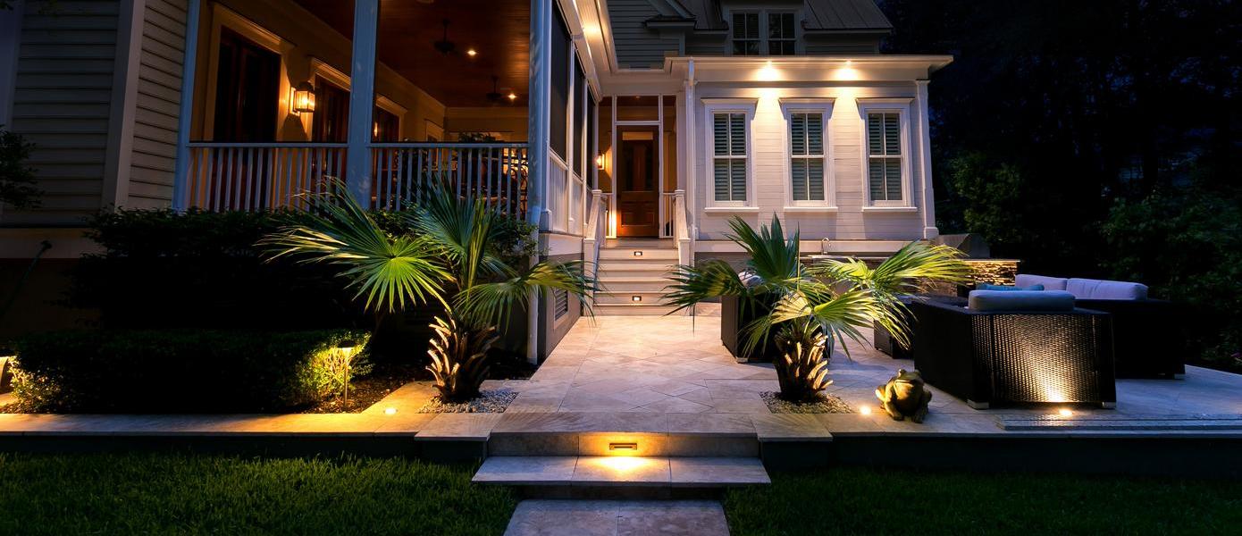 A house with palm trees and a walkway